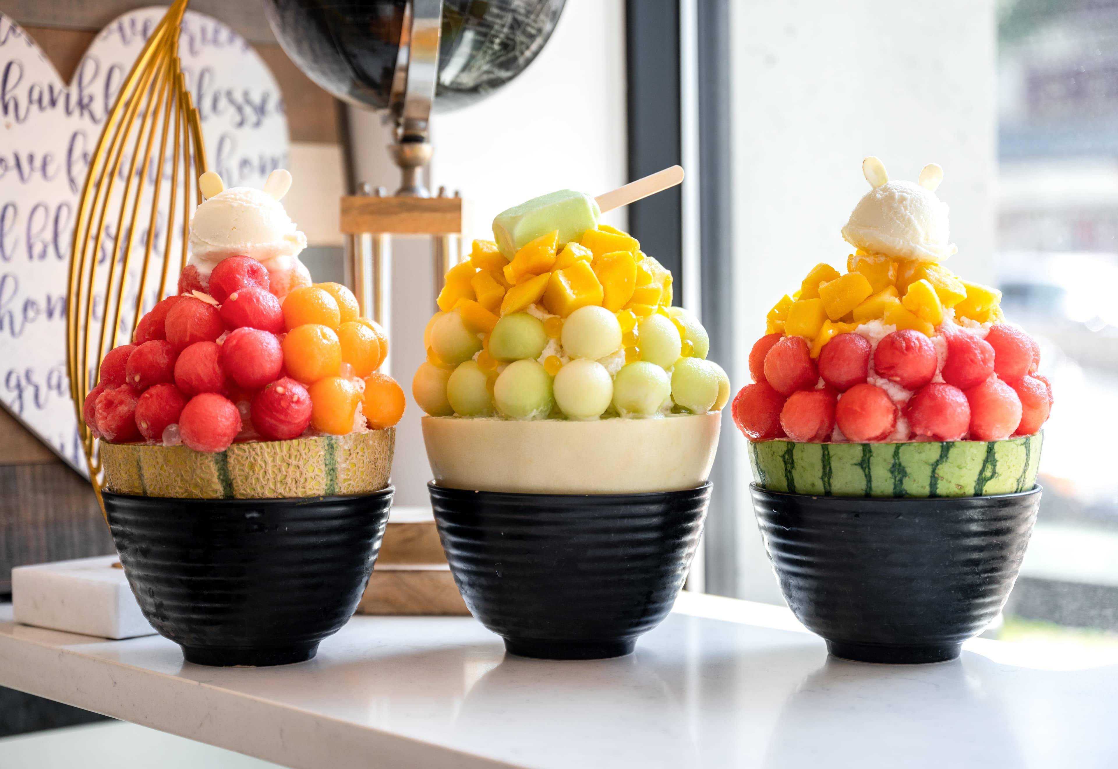 Signature Ice Pot shaved ice desserts topped with fresh melon and mango at 17˚C Bubble Tea & Dessert Café